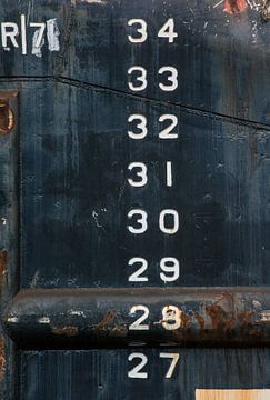 Ship hulls with their calibration marks in the harbor. by scheepskijkerhavenfotografie