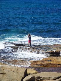 Fisherman on rocks by Sanne Bakker