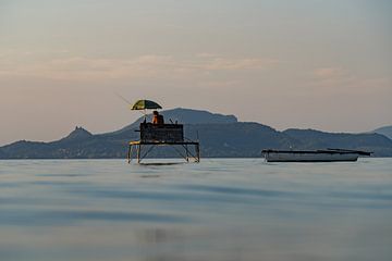 Anglers at sunset at Lake Balaton in Hungary