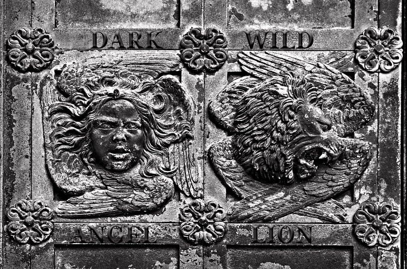 Medieval wooden door at Ribe Cathedral with angel and lion by Silva Wischeropp