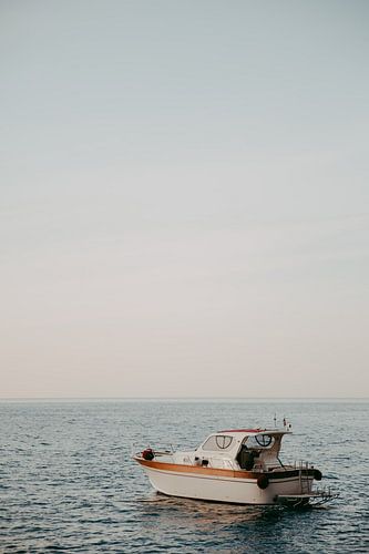 boat at sunrise on the mediterranean sea amalfi coast italy