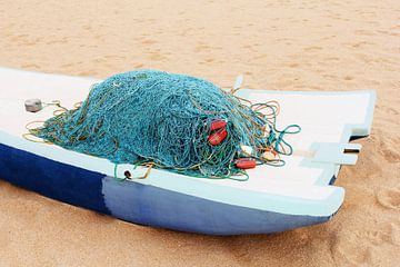 Fishing nets in boat by Inge Hogenbijl