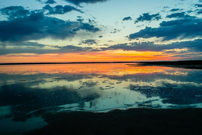 colored sky over the Wadden Sea at the North Sea by Animaflora PicsStock