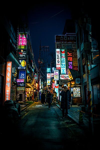 Brightly coloured advertising signs in Seoul by Mickéle Godderis