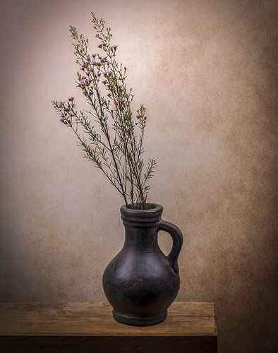 Still life of a jug with flowers