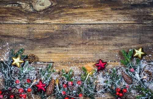 Natural Christmas border frame decoration with light, green fir branches, red berries