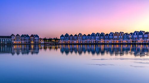Houses at the lake at sunset