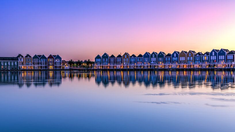 Houses at the lake at sunset by Rene Siebring