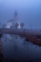 The white church of Simonshaven in the fog