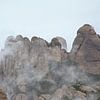 Bergtoppen van Montserrat in de wolken van Kristof Lauwers