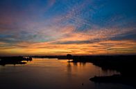 zonsondergang boven de Lek van George Burggraaff thumbnail