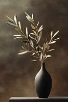 Olive branch in dark vase