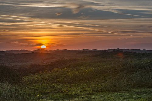 zonsondergang boven de duinen