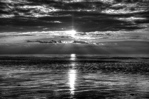 zonsondergang aan zee