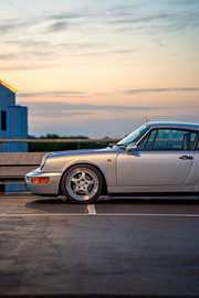 Porsche 911 urban sunset front van The Wandering Piston