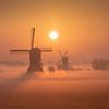 Windmills at sunrise I by Sven Broeckx