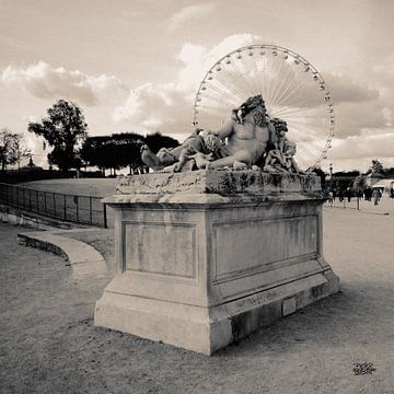 foto van een beeld in een park van Parijs en het reuzenrad