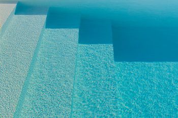 Different kinds of blue rippling water in a pool with sunshine