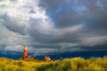 Texel lighthouse in the dunes with a storm sky above by Sjoerd van der Wal Photography