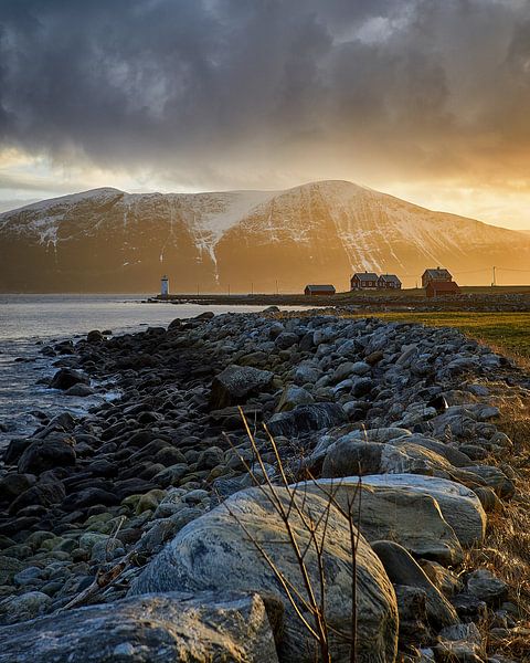 Golden light of the setting sun above the Høgstein lighthouse, Godøy, Norway by qtx