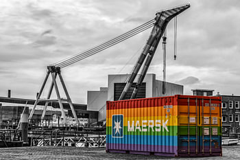 maersk container somewhere in the port of rotterdam