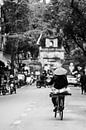 Cyclist in Hanoi, Vietnam by Karsten Glasbergen thumbnail