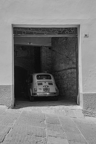 Fiat 500 vintage car in Italian garage (black and white)