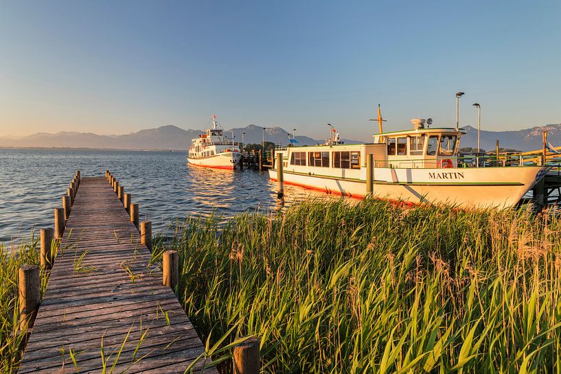 ships at the landing stage at sunrise, Chiemsee, Bavaria, Germany by Markus Lange