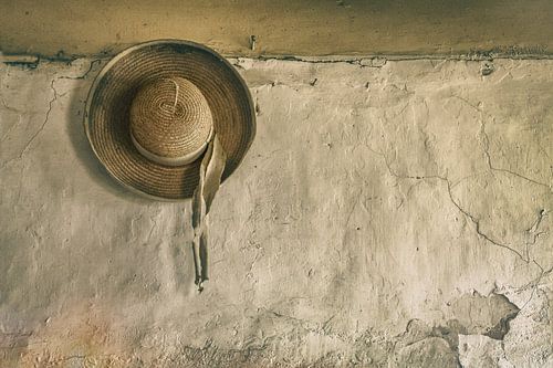 Sun hat on old wall
