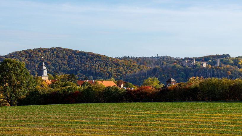The church tower of Herleshausen in autumn by Roland Brack