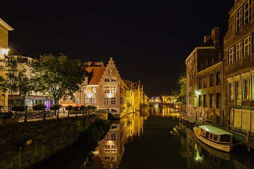 Ghent at night. The Leie with the Grootkanon De Dulle Griet on the left