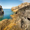 Coastal landscape with imposing rock formations by Karla Leeftink