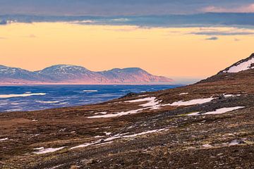 View over the lake Lagarfljót to snow-covered mountains in the east by Rico Ködder