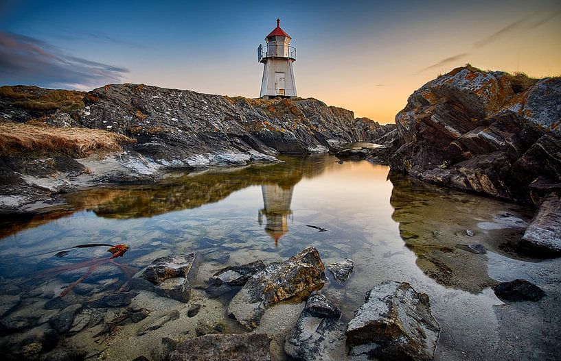 Reflection in the tidal pool of the lighthouse on Vigra, Norway by qtx