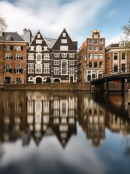 Canal and old houses in Amsterdam on Oudezijds Voorburgwal by Lorena Cirstea