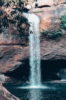 Waterfall and rock in the jungle in Thailand.