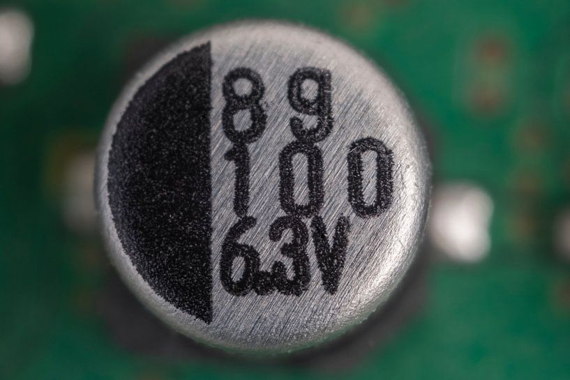 Electrolytic Capacitor close-up by Pieter van Roijen