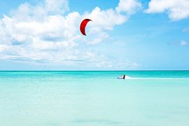 Kite surfing on the Caribbean Sea near Aruba by Eye on You