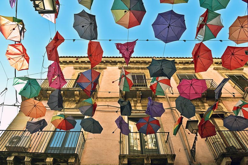 Colourful umbrellas in the sky over Catania by Silva Wischeropp