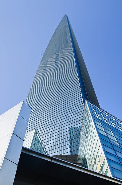 Shanghai World Financial Center against a blue sky  by Tony Vingerhoets