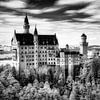 Majestic Neuschwanstein Castle in a surreal, dreamlike landscape - infrared black and white photo print by Hidden Light Gallery