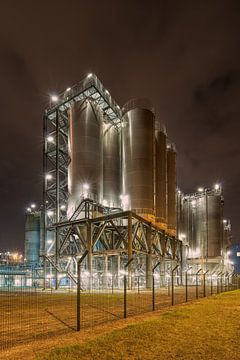 Petrochemical production plant with large silos at night, Antwerp by Tony Vingerhoets