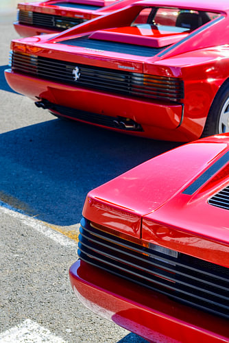 Three red Ferrari Testarossa 1980s sports cars
