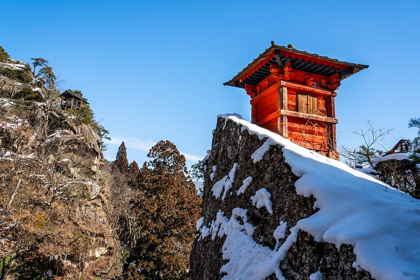 Red turret in the snow near Yamadera by Mickéle Godderis