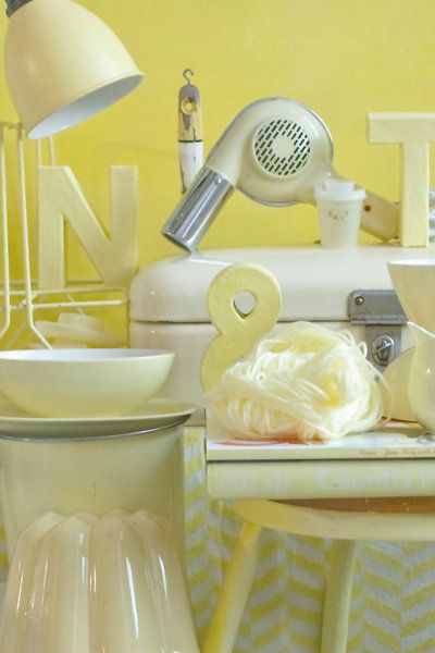 Photo of a still life with retro/vintage stuff in soft yellow. by Therese Brals