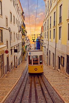 Traditional Bica tram riding in Lisbon Portugal at sunset by Eye on You