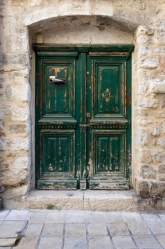Stately old green rustic wooden door