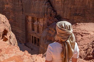 Nomad overlooks Petra's Treasury. by Floyd Angenent