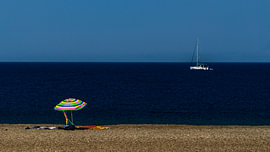 the parasol and the little boat by SappiesPhoto