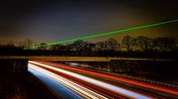 Laser light over the highway. Long exposure shot